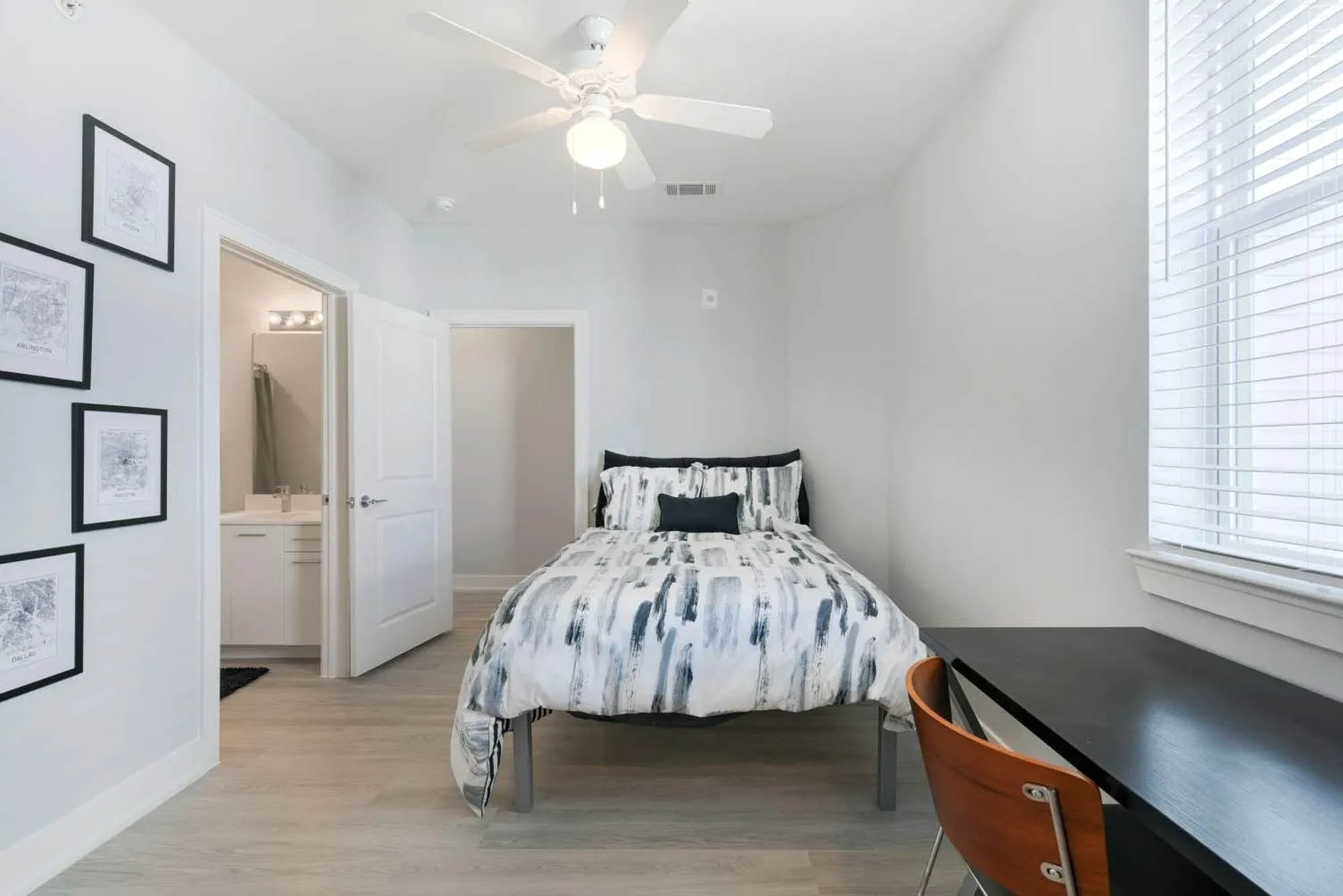 Minimalist bedroom with desk and bed.