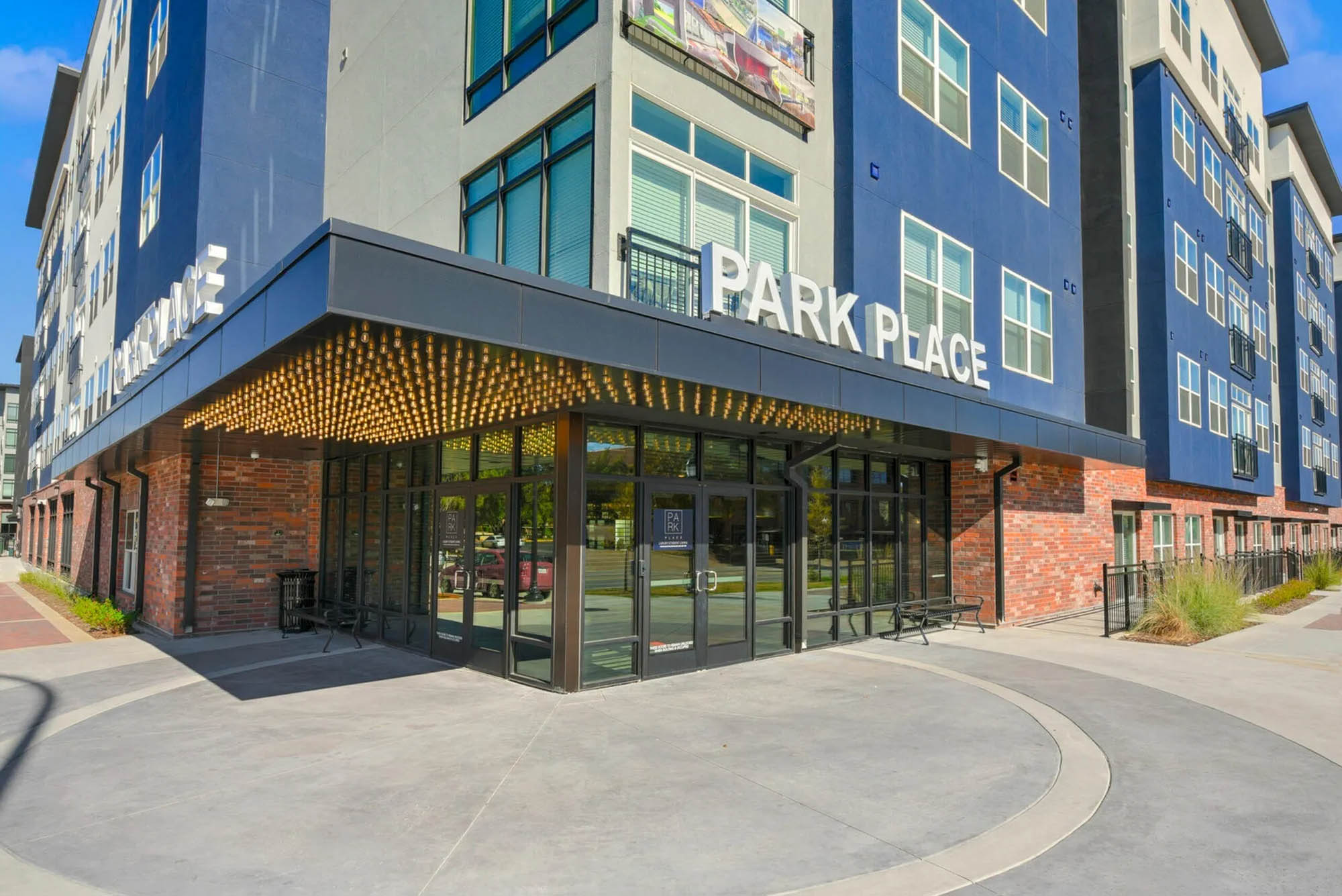 Modern apartment building entrance with signage